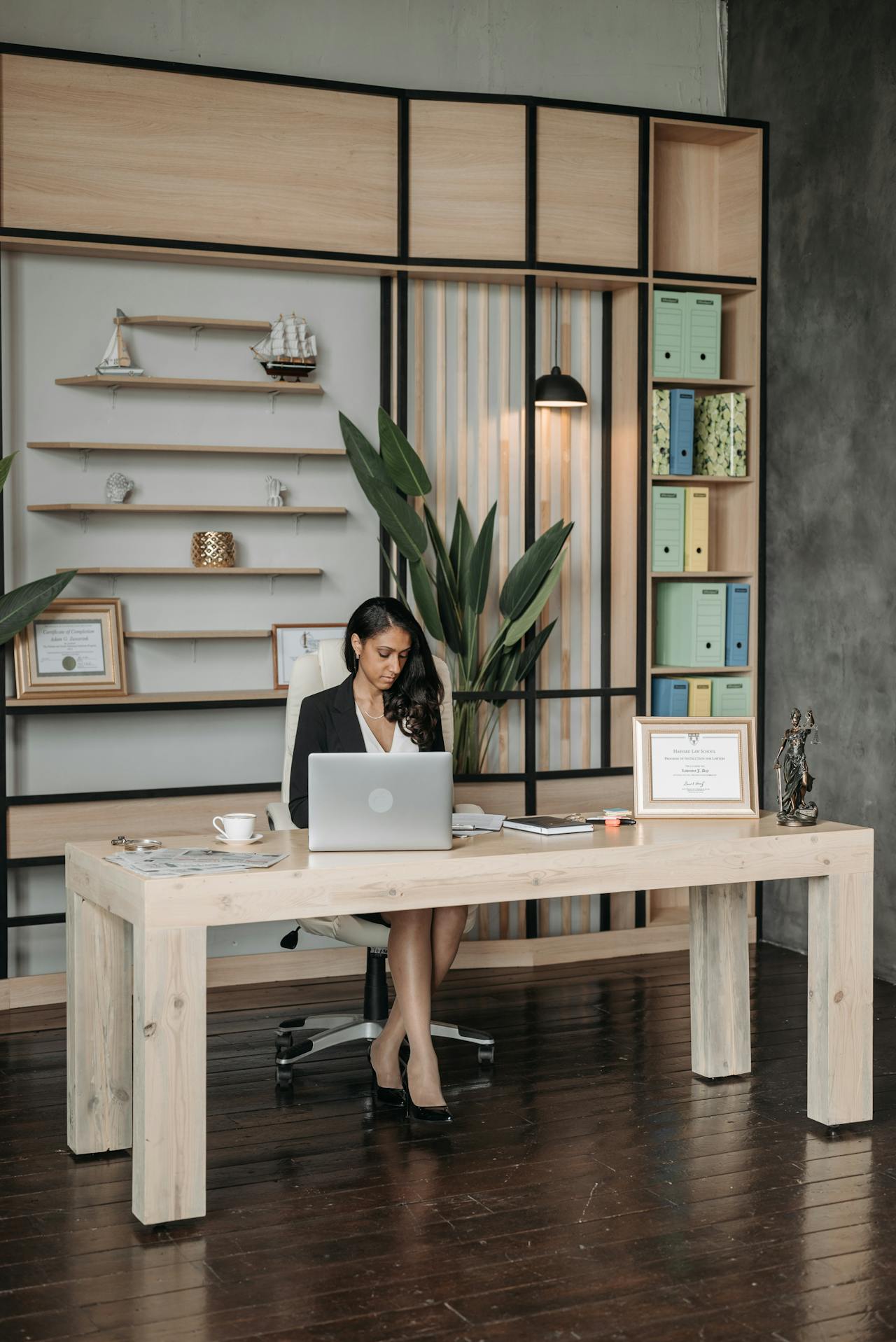 lawyer sat behind desk in legal office