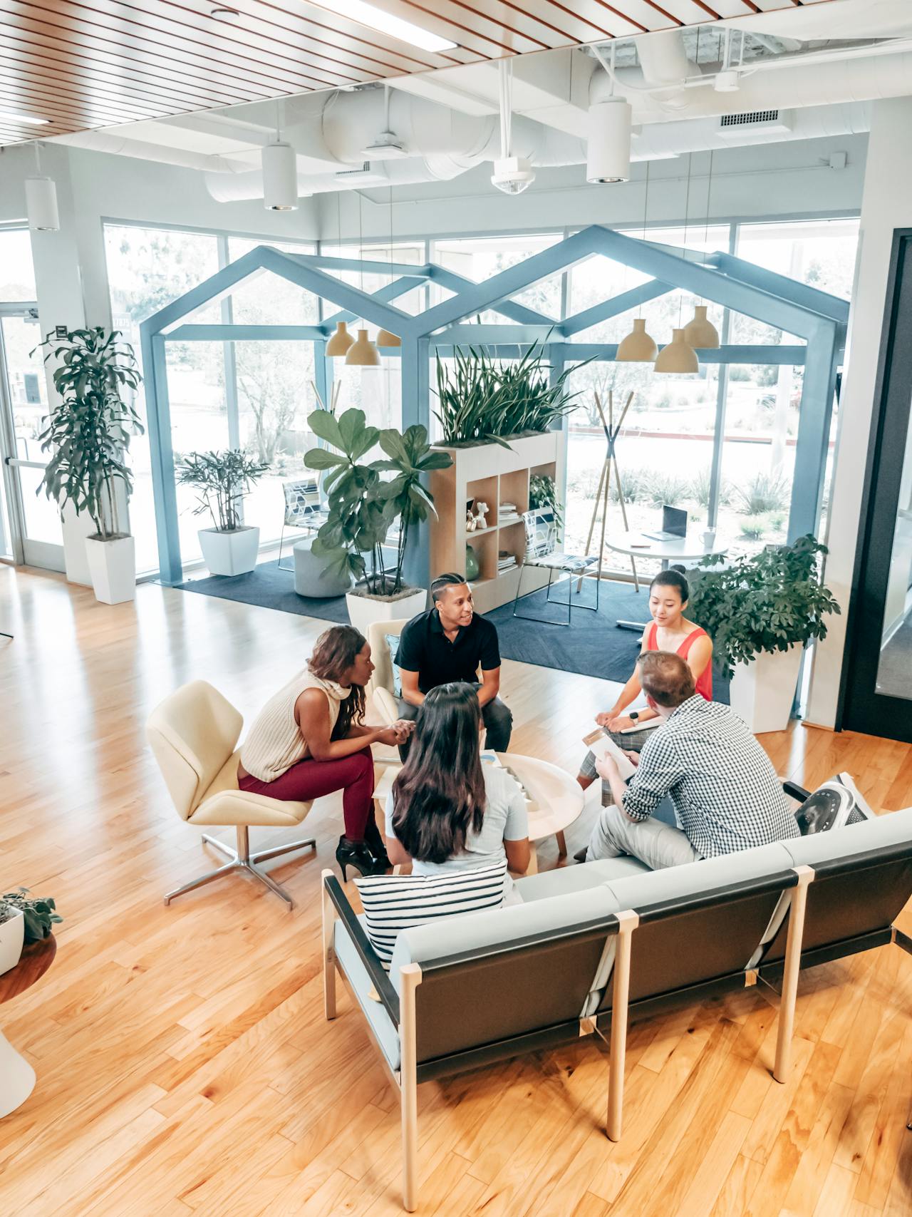 team sitting round table having a meeting at small business